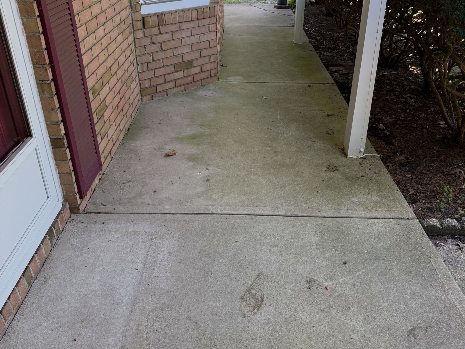 Concrete side walk by brick, before — Catanzaro's Power Washing