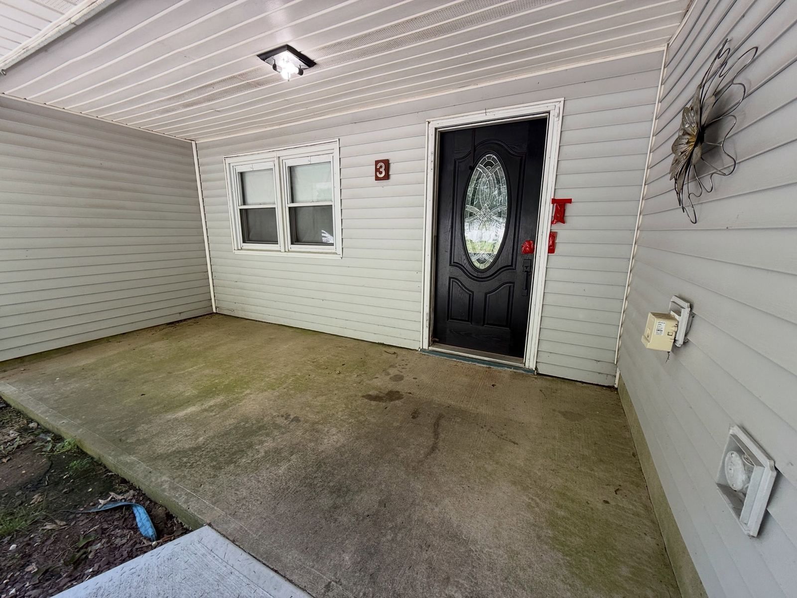 Covered porch concrete, dirty — Catanzaro's Power Washing