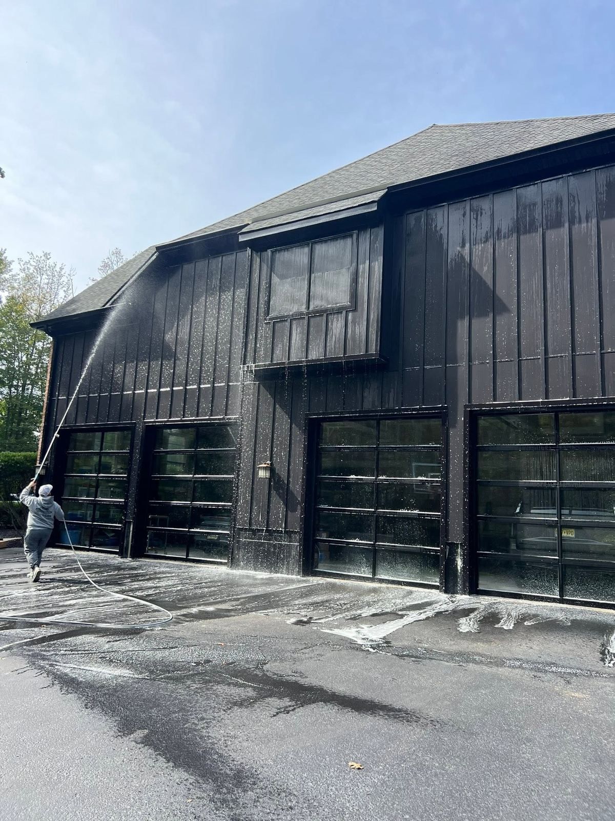 Dark garage driveway being washed — Catanzaro's Power Washing