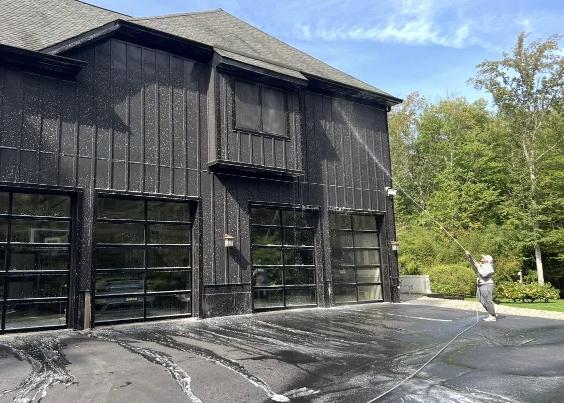Dark garage driveway washed — Catanzaro's Power Washing