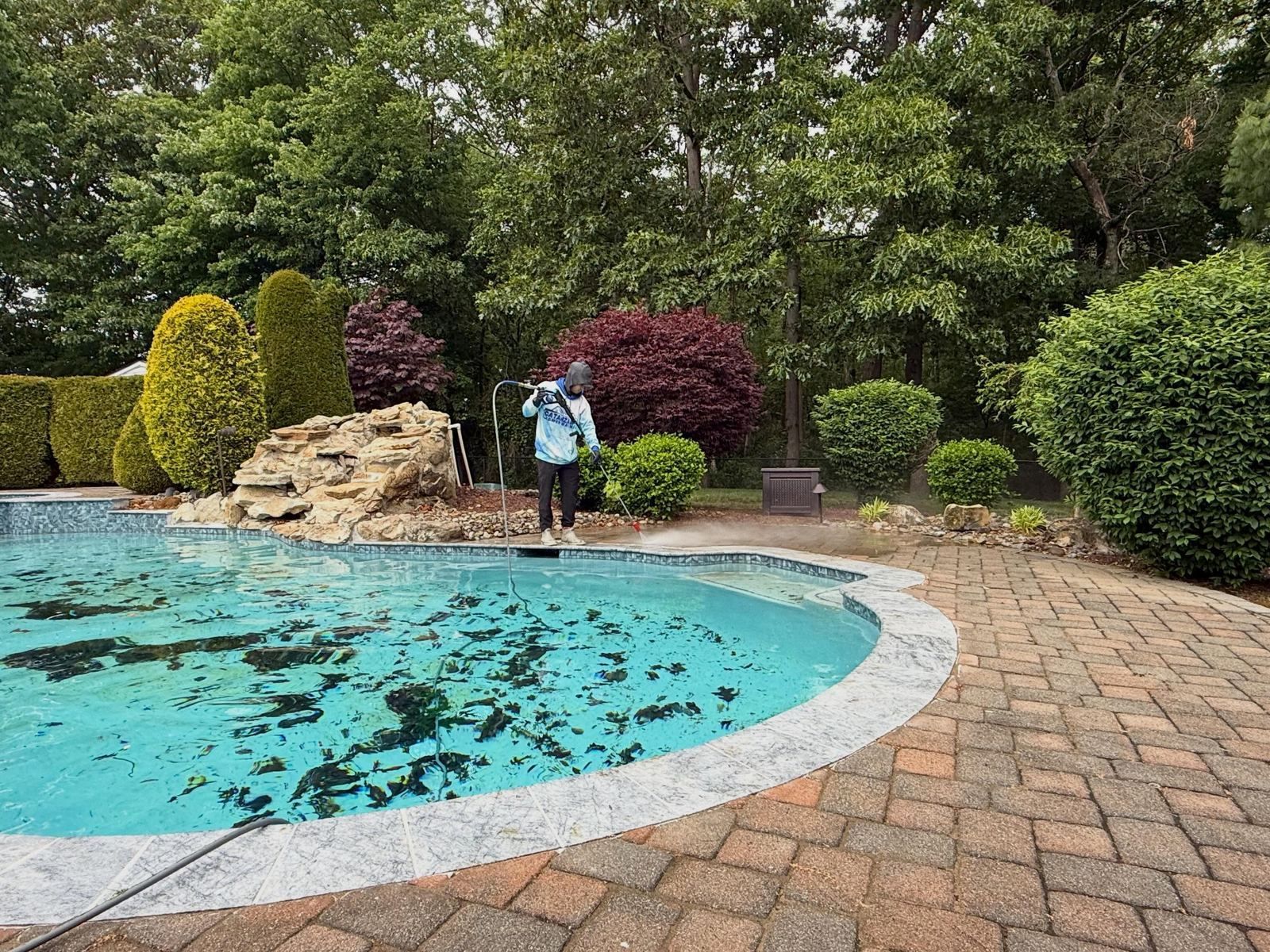 Paver pool deck being washed — Catanzaro's Power Washing