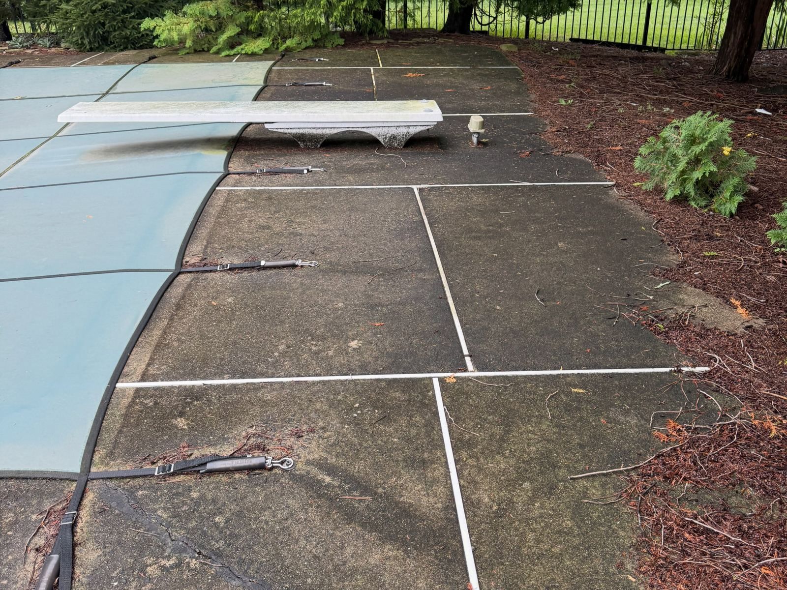 Pool deck concrete with cover, dirty — Catanzaro's Power Washing