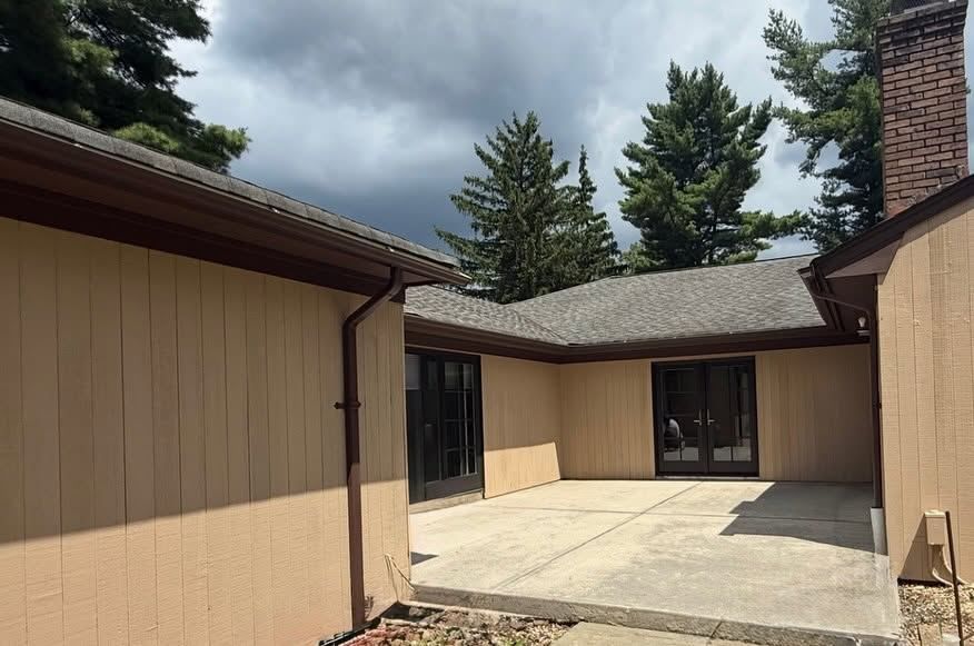Wood-sided ranch courtyard, painted tan — Catanzaro's Power Washing