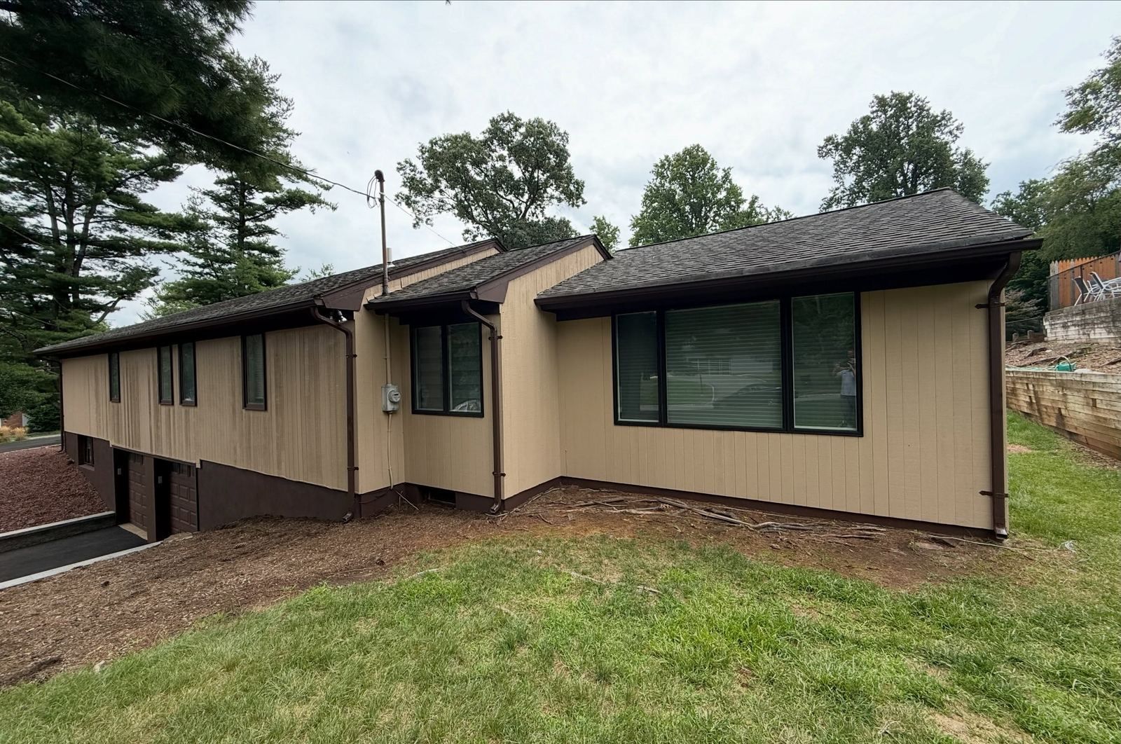Wood-sided ranch side, painted tan — Catanzaro's Power Washing