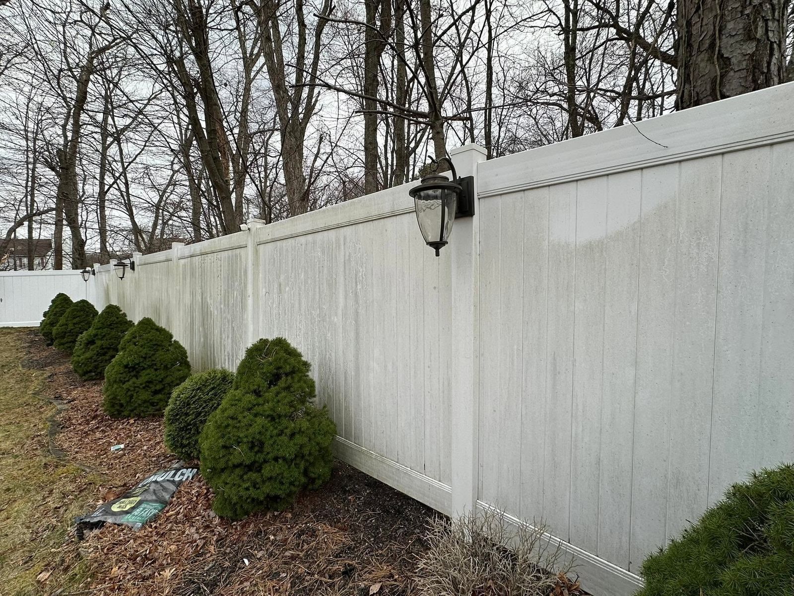 White vinyl fence with lamp — Catanzaro's Power Washing