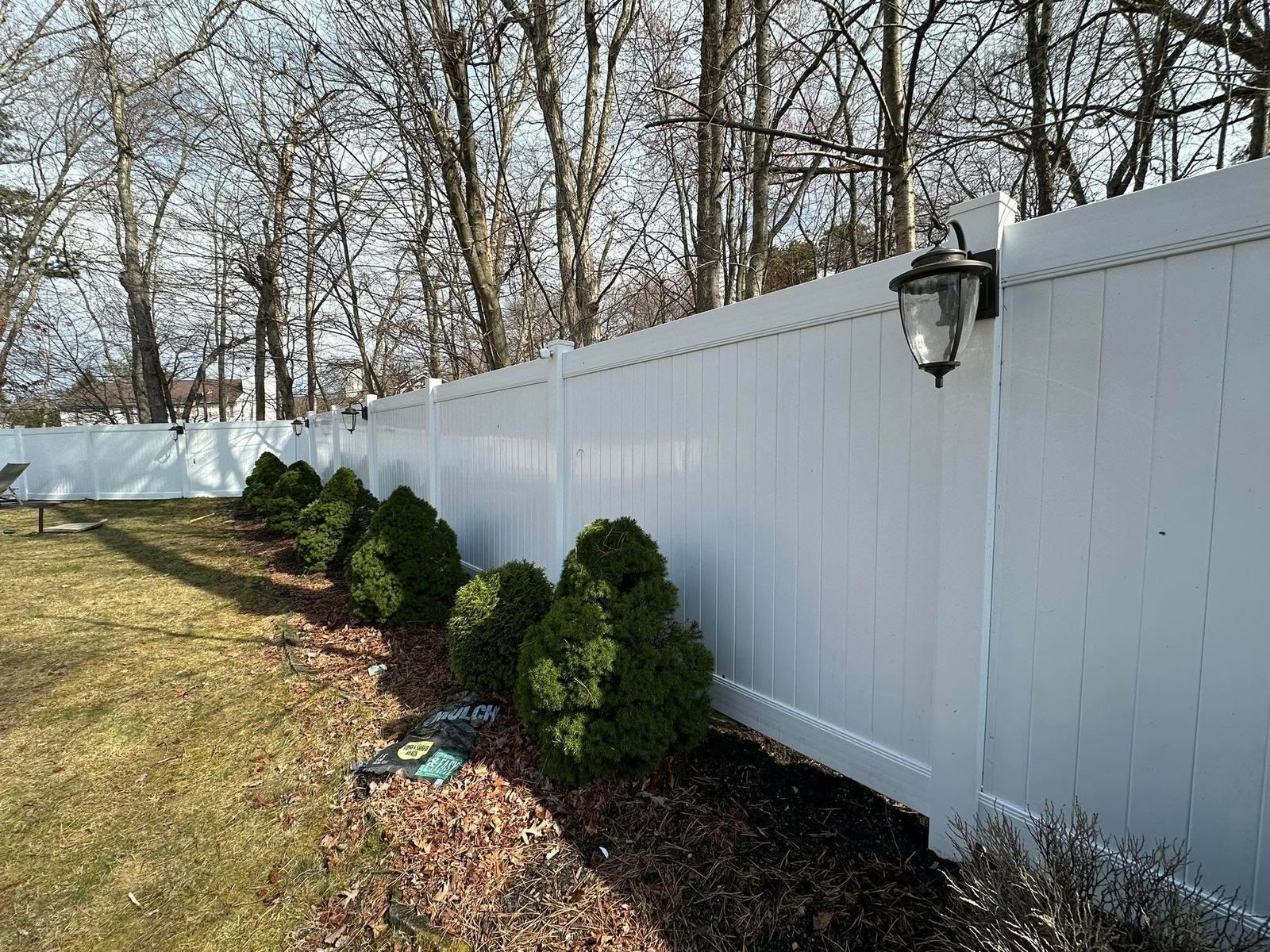 White vinyl fence along yard — Catanzaro's Power Washing