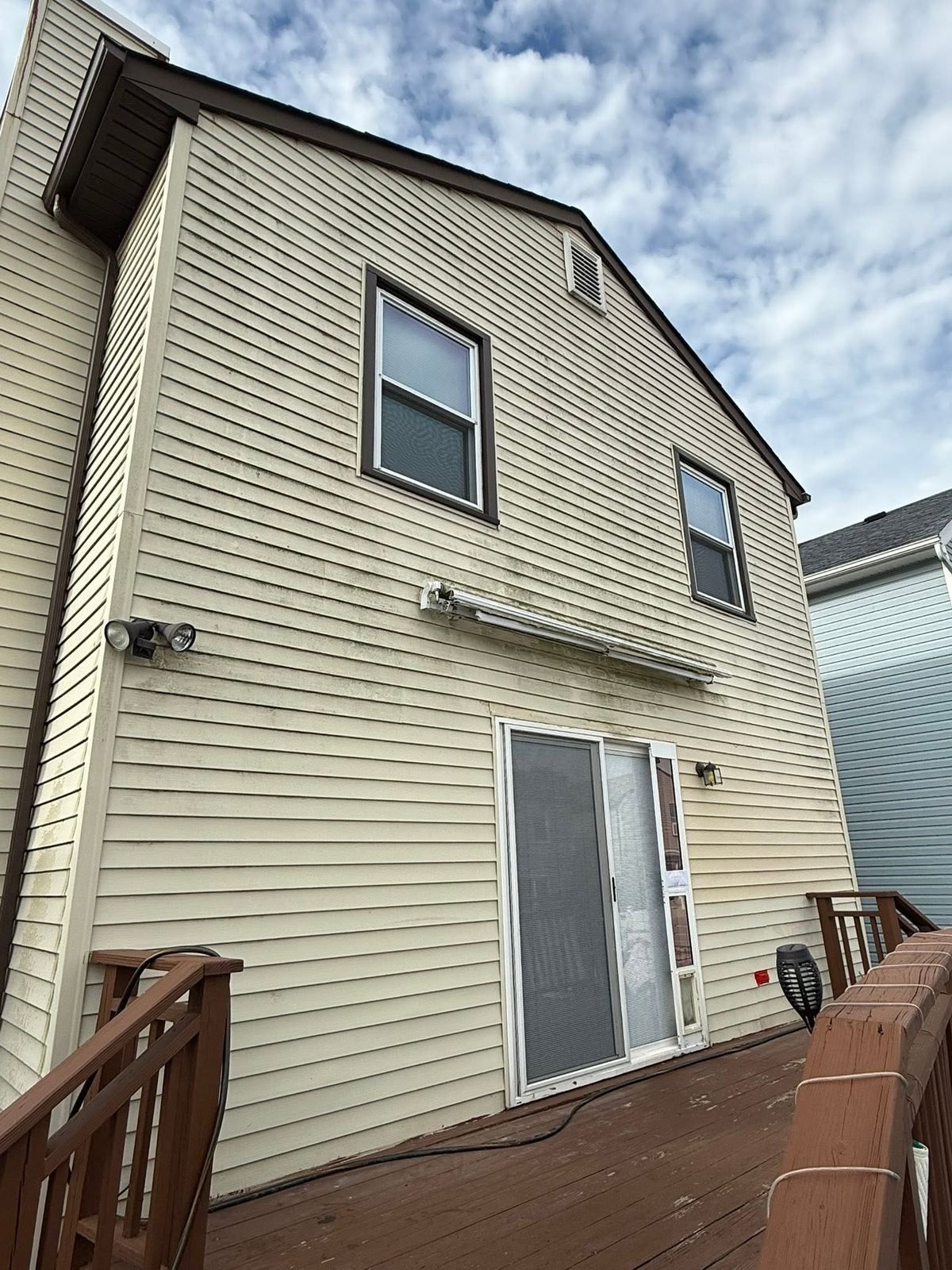 Beige two-story with small deck — Catanzaro's Power Washing