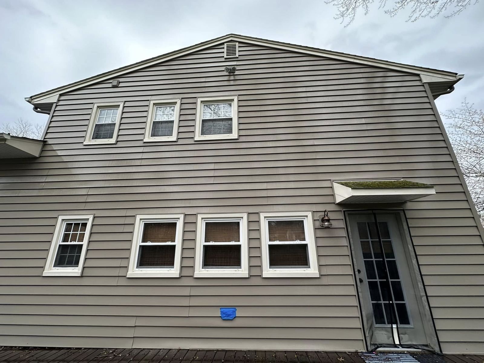 Beige two-story rear, siding washed — Catanzaro's Power Washing