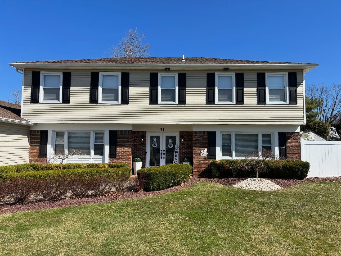 Center-hall colonial front with brick lower — Catanzaro's Power Washing