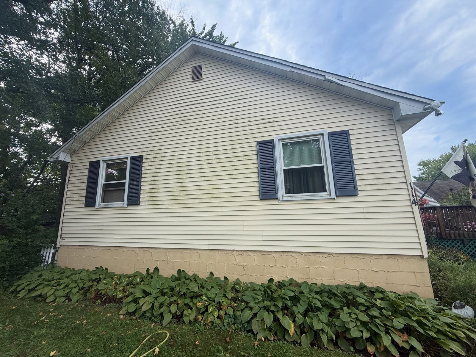 Cream gable with black shutters, washed — Catanzaro's Power Washing