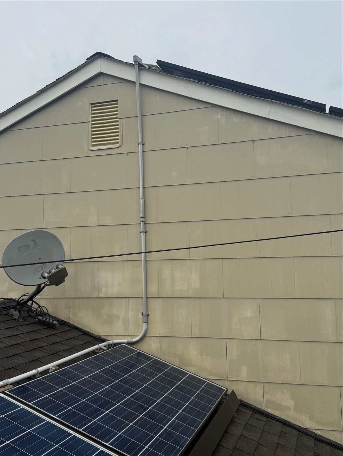 Gable siding with solar panel and dish — Catanzaro's Power Washing