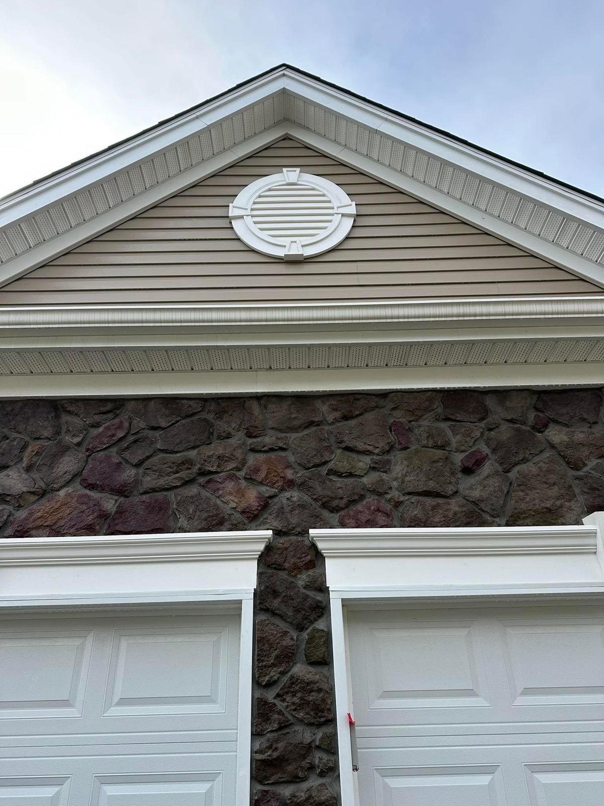 Gable vent and stone front over garage — Catanzaro's Power Washing