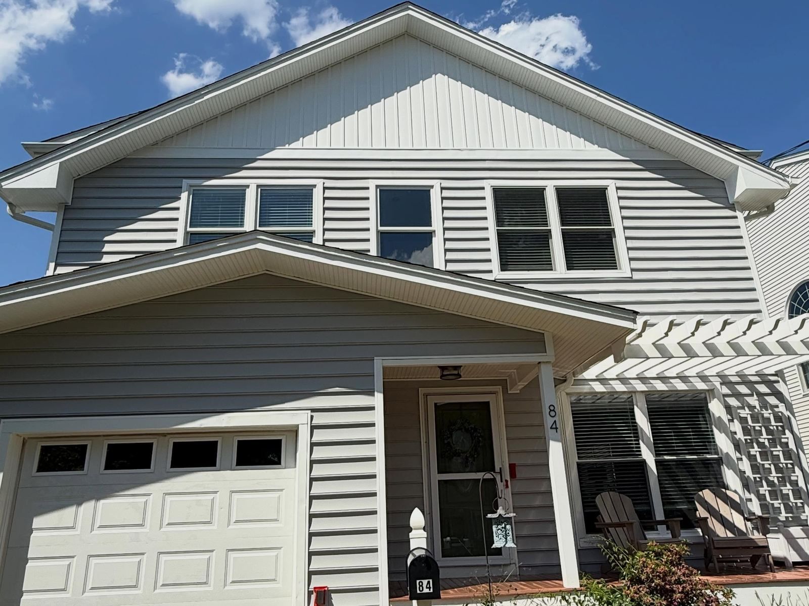 Gray shore house front with garage — Catanzaro's Power Washing