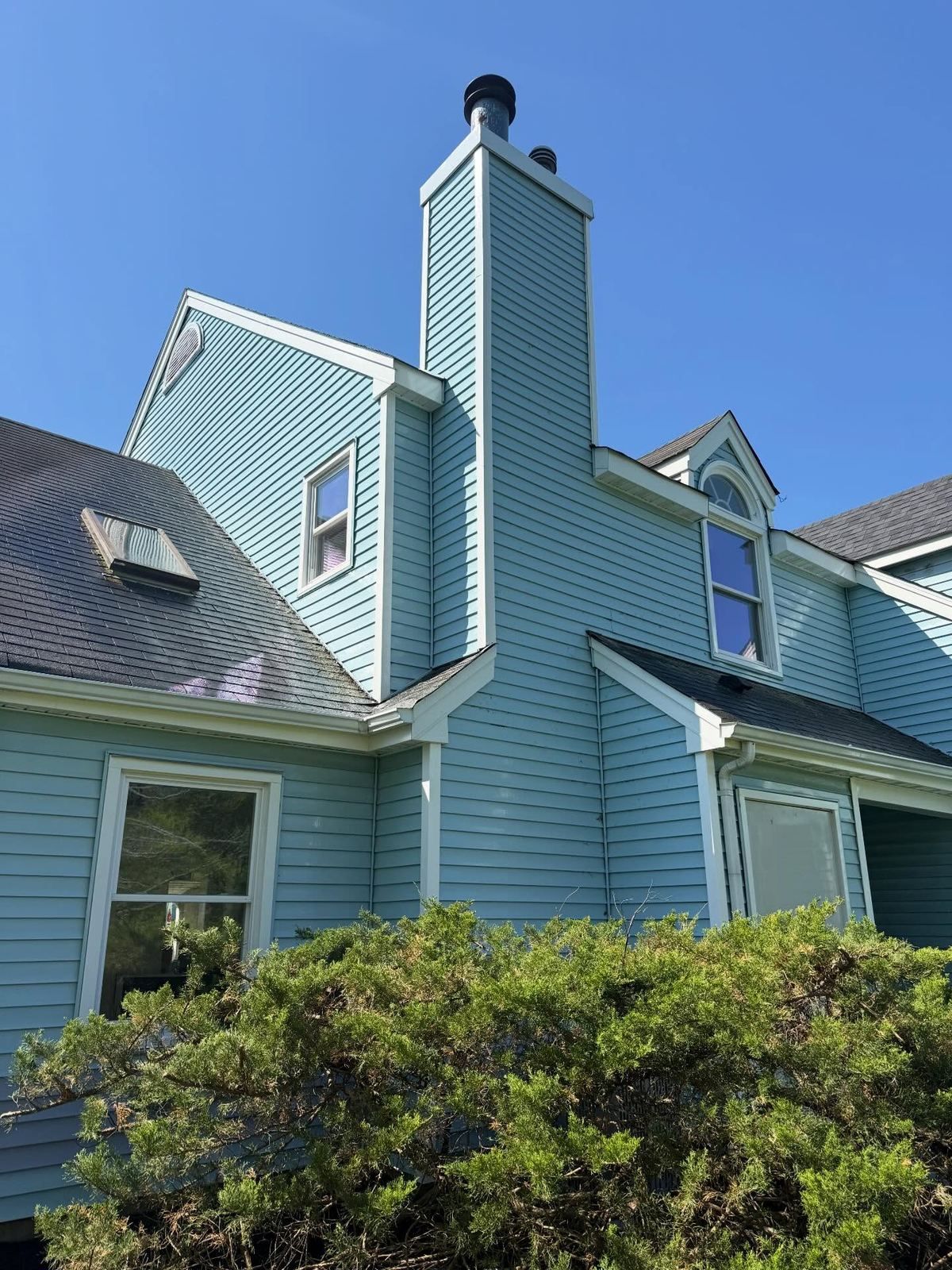 Light blue contemporary with chimney — Catanzaro's Power Washing
