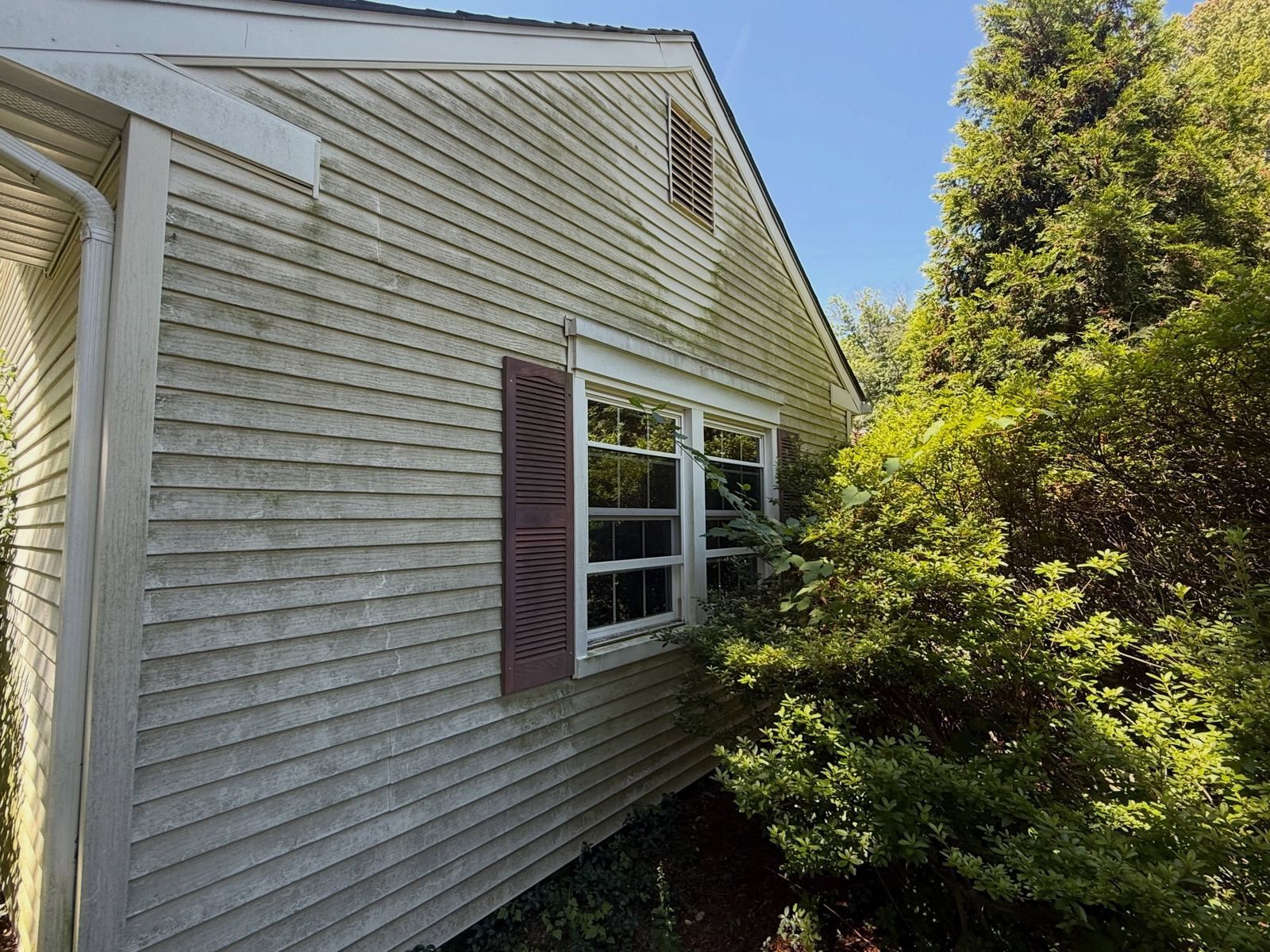 Siding gable with burgundy shutters — Catanzaro's Power Washing