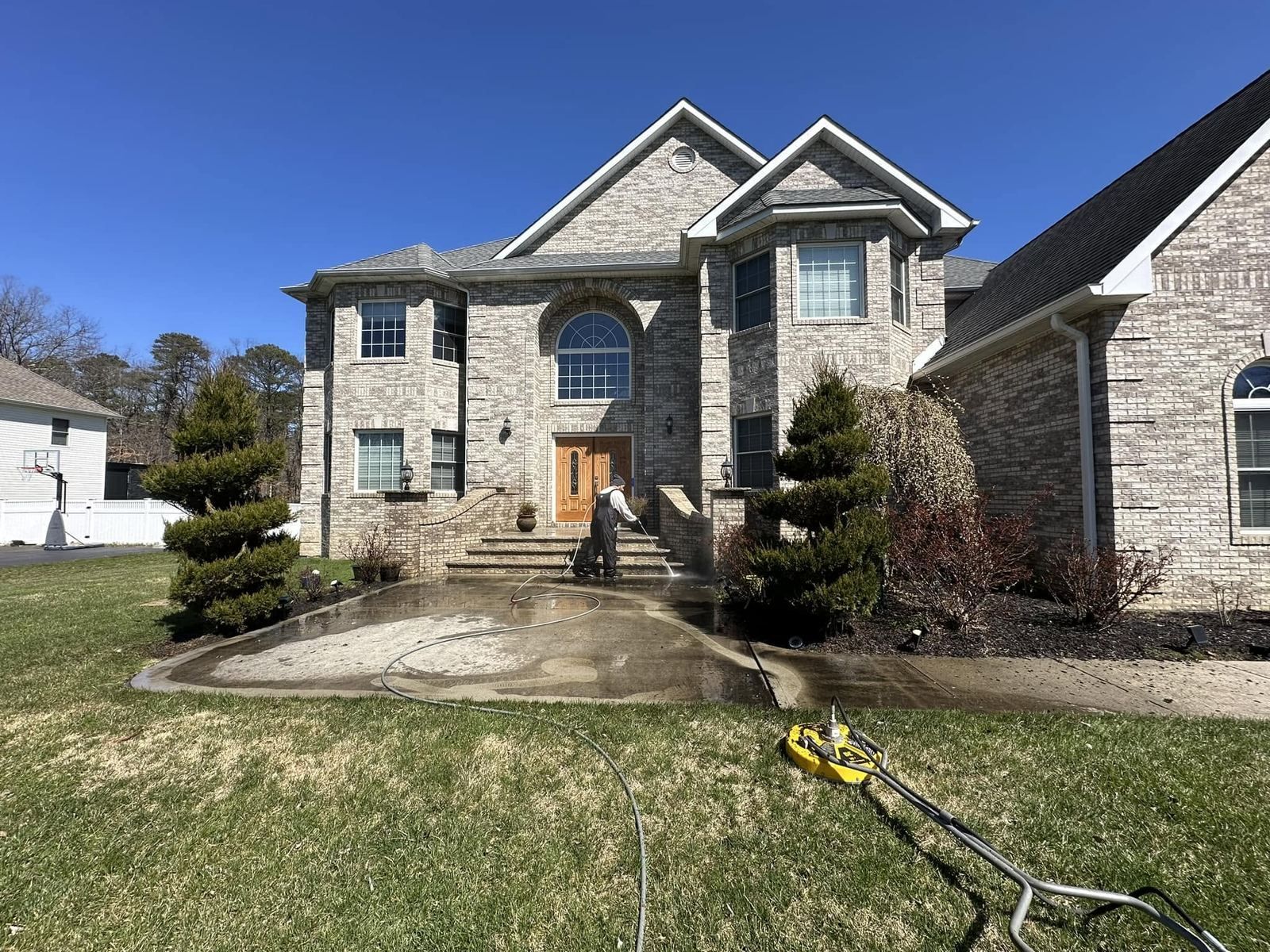 Stone-front colonial, crew washing front walk — Catanzaro's Power Washing