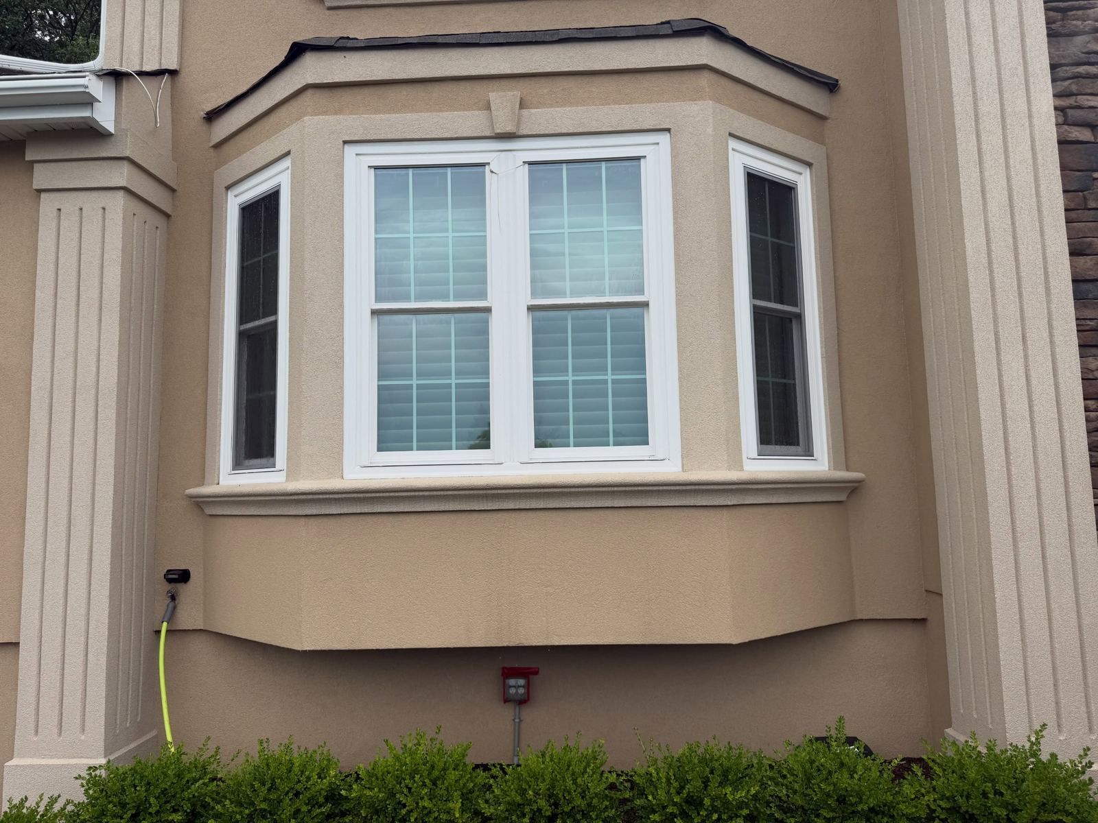 Stucco bay window, washed — Catanzaro's Power Washing