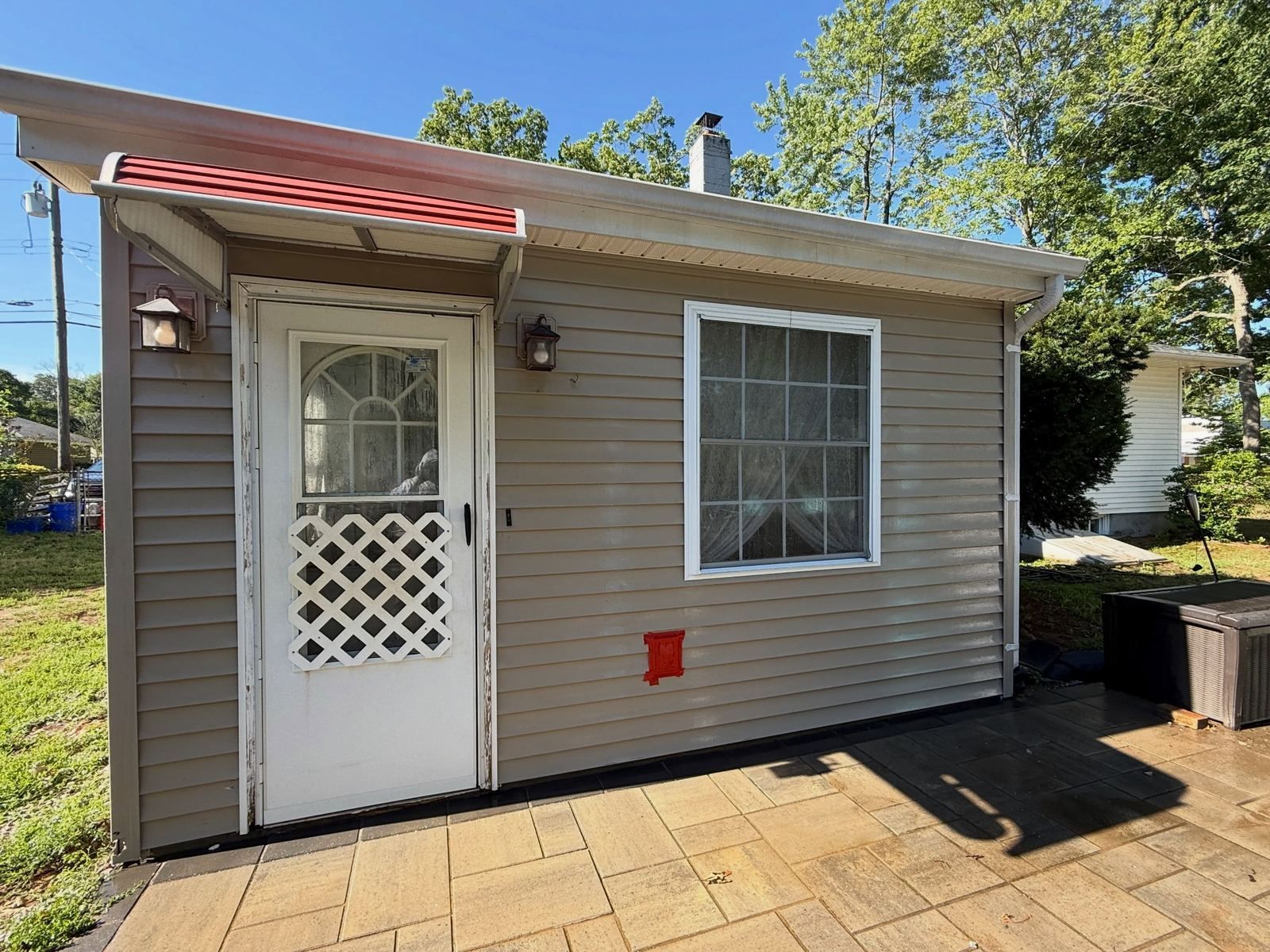 Tan addition with lattice door, washed — Catanzaro's Power Washing