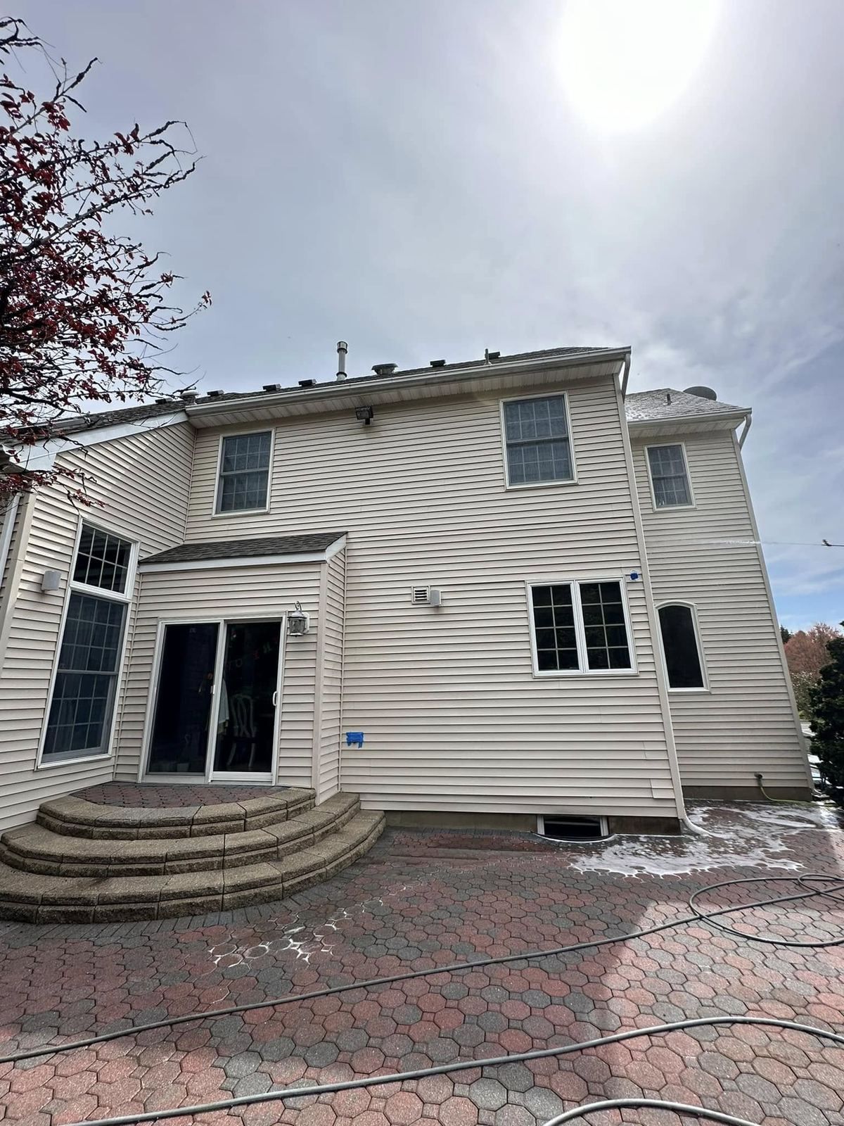 Two-story rear with brick patio steps — Catanzaro's Power Washing