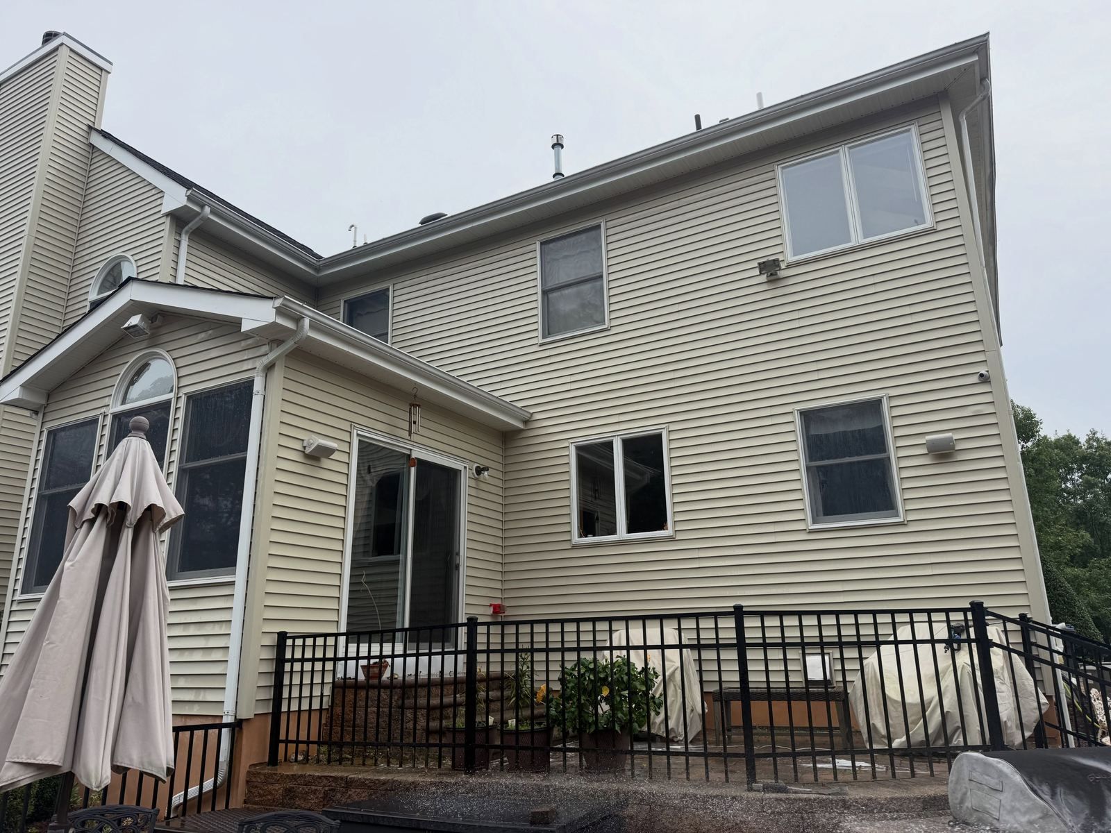 Two-story rear with fenced patio — Catanzaro's Power Washing