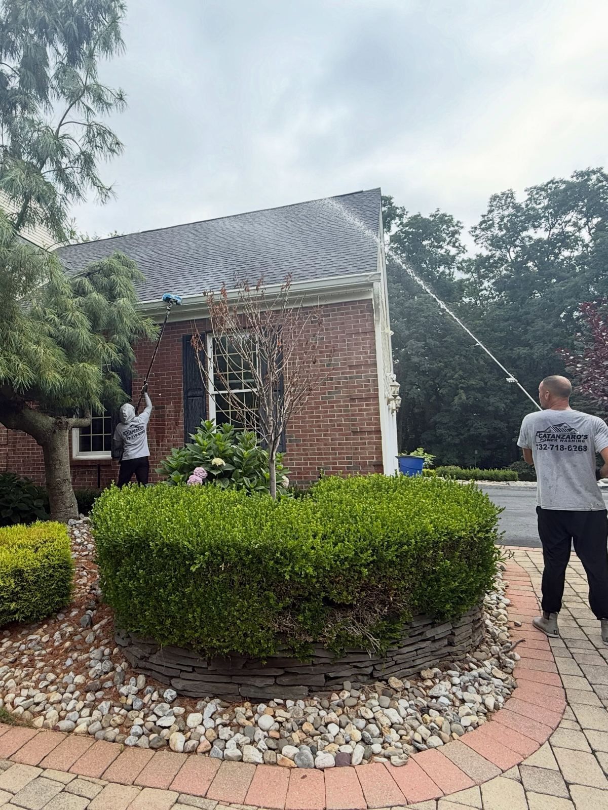 Crew washing brick colonial with walk — Catanzaro's Power Washing