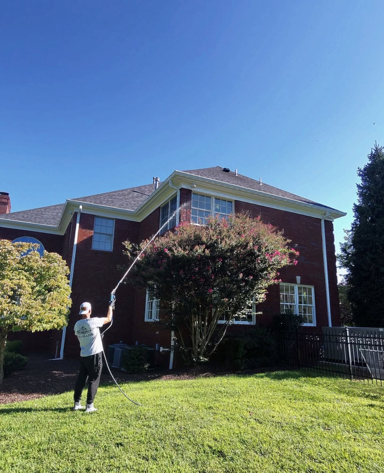Crew washing brick colonial rear — Catanzaro's Power Washing