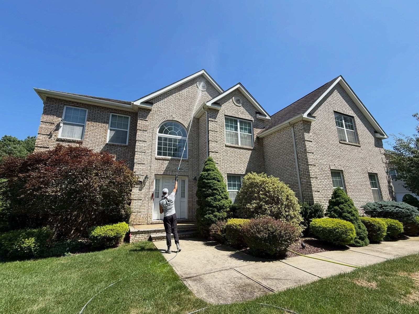 Crew washing brick-and-siding colonial — Catanzaro's Power Washing