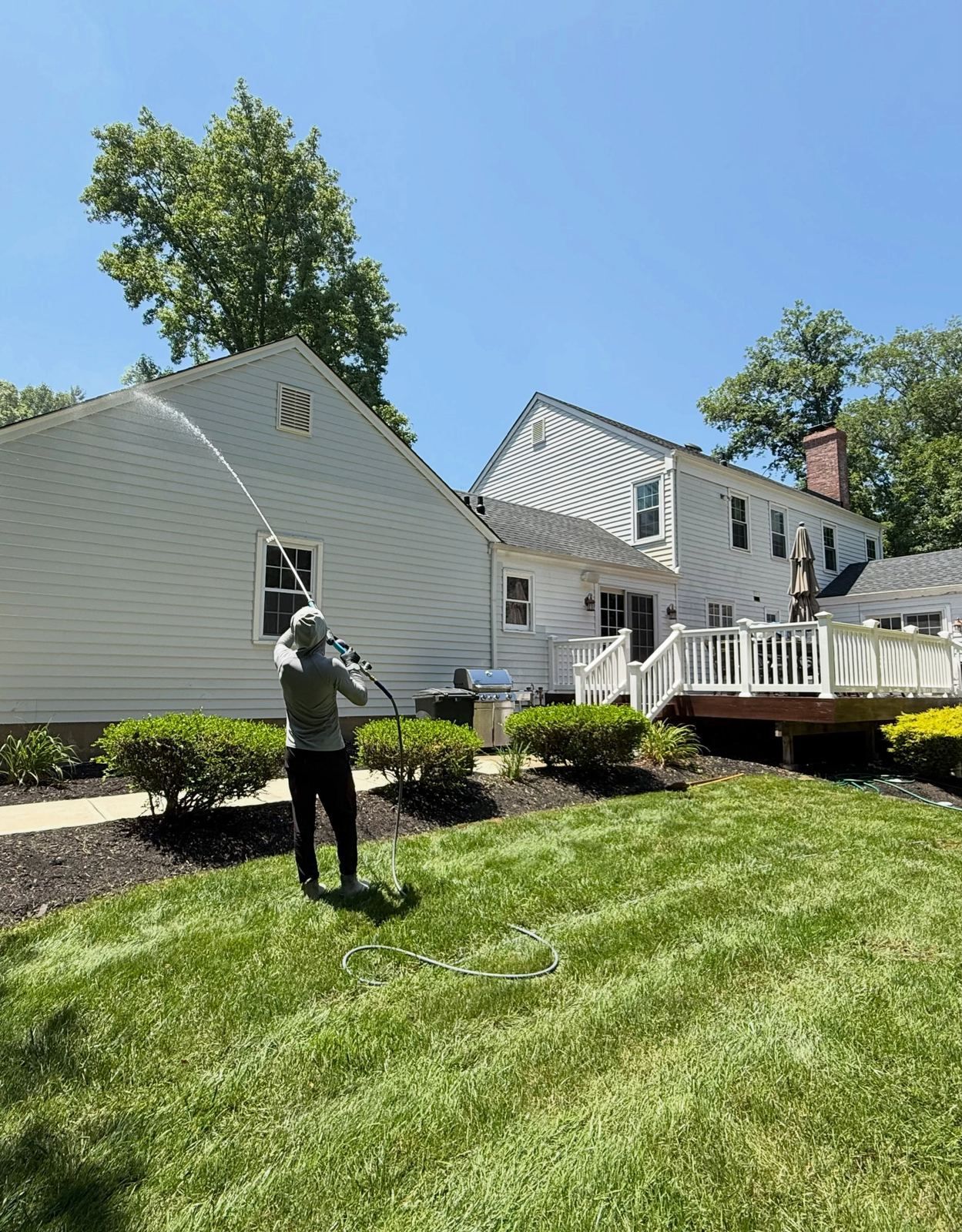 Crew washing house side lawn — Catanzaro's Power Washing