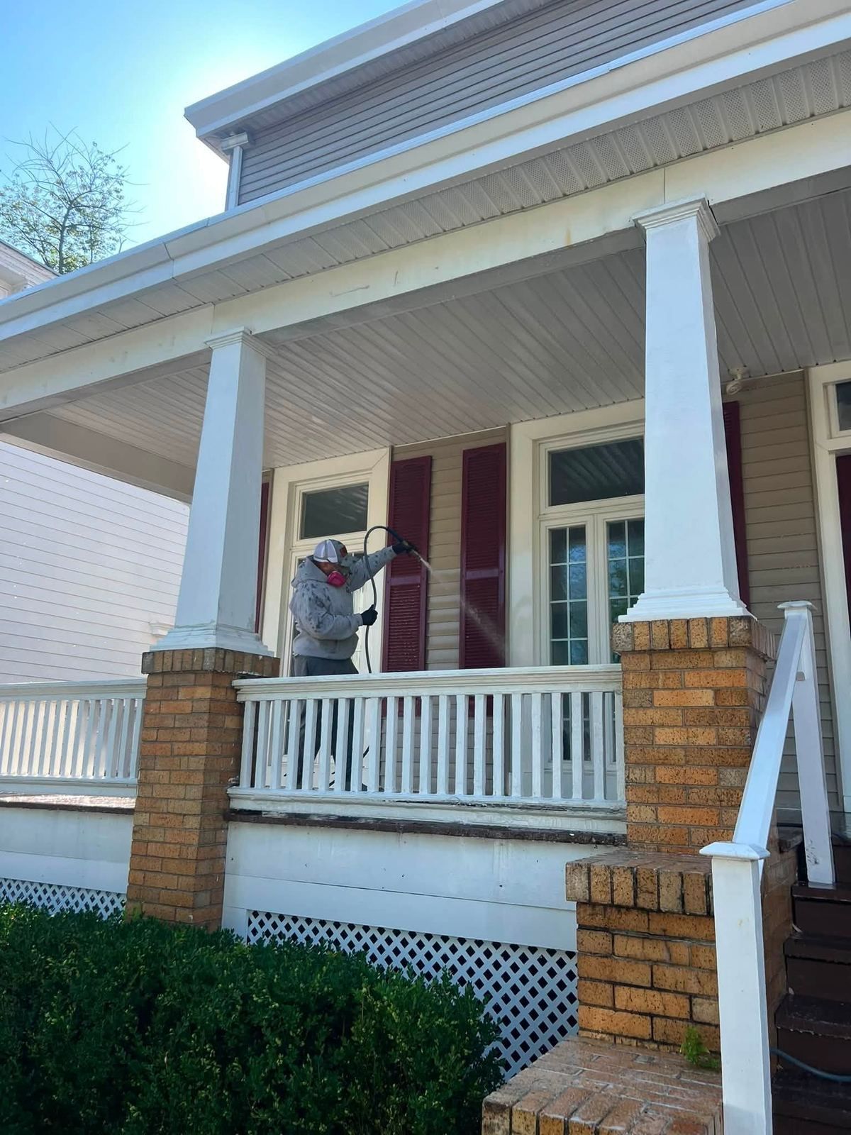 Crew washing porch ceiling and columns — Catanzaro's Power Washing