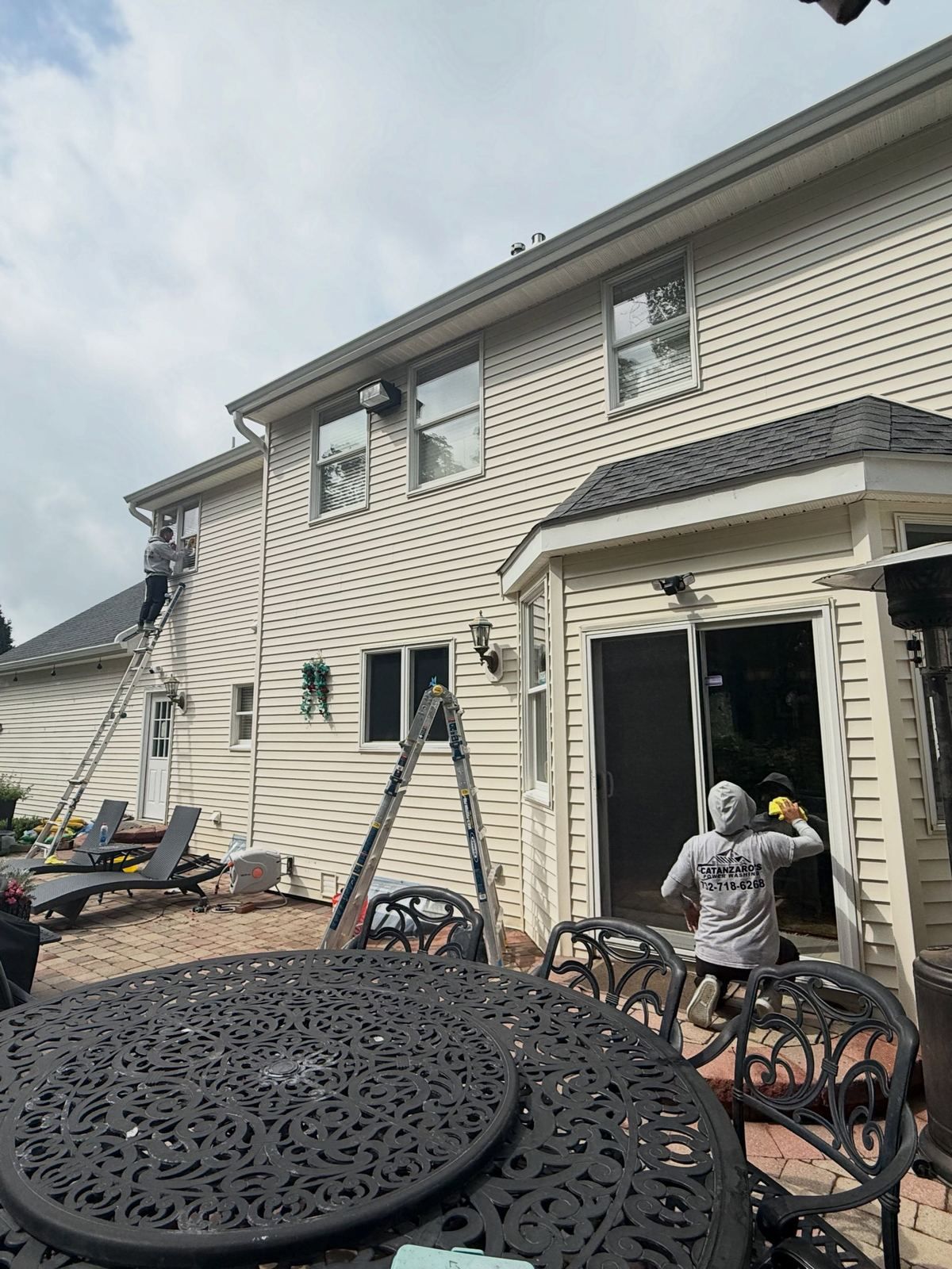 Crew washing rear with patio set — Catanzaro's Power Washing