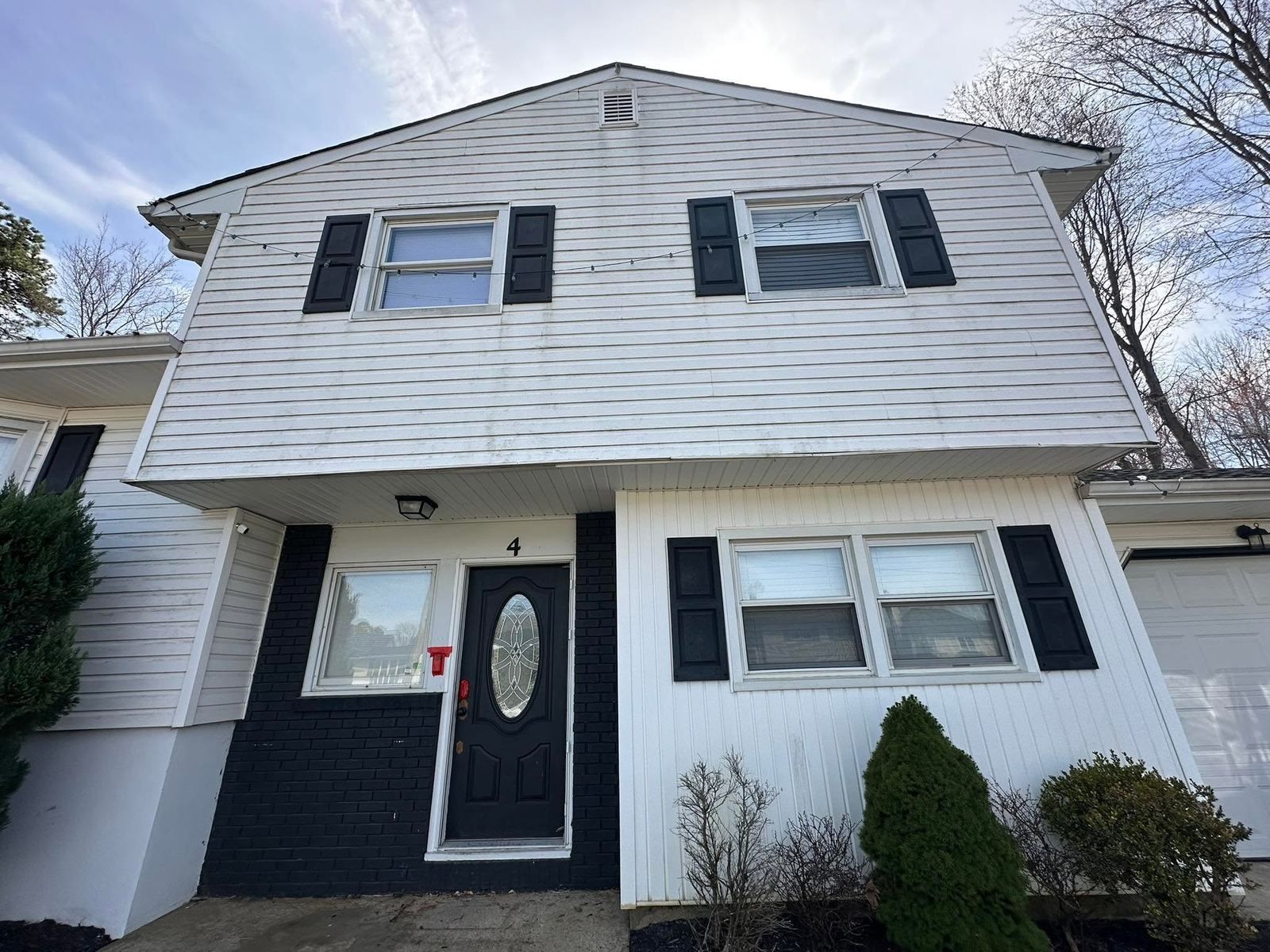White colonial front with black shutters — Catanzaro's Power Washing