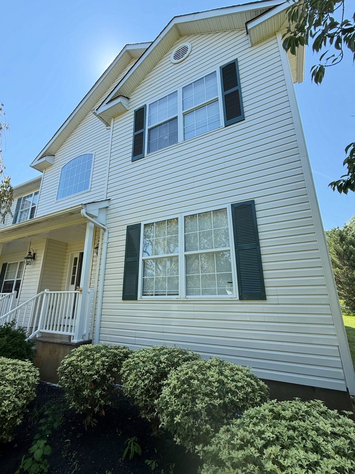 White colonial with green shutters — Catanzaro's Power Washing