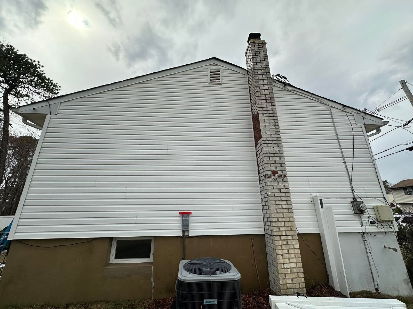 White siding with chimney, side — Catanzaro's Power Washing
