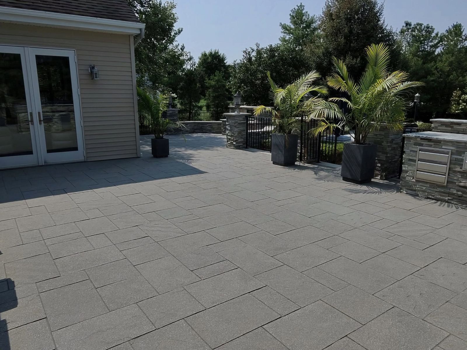Paver patio with planters, cleaned — Catanzaro's Power Washing
