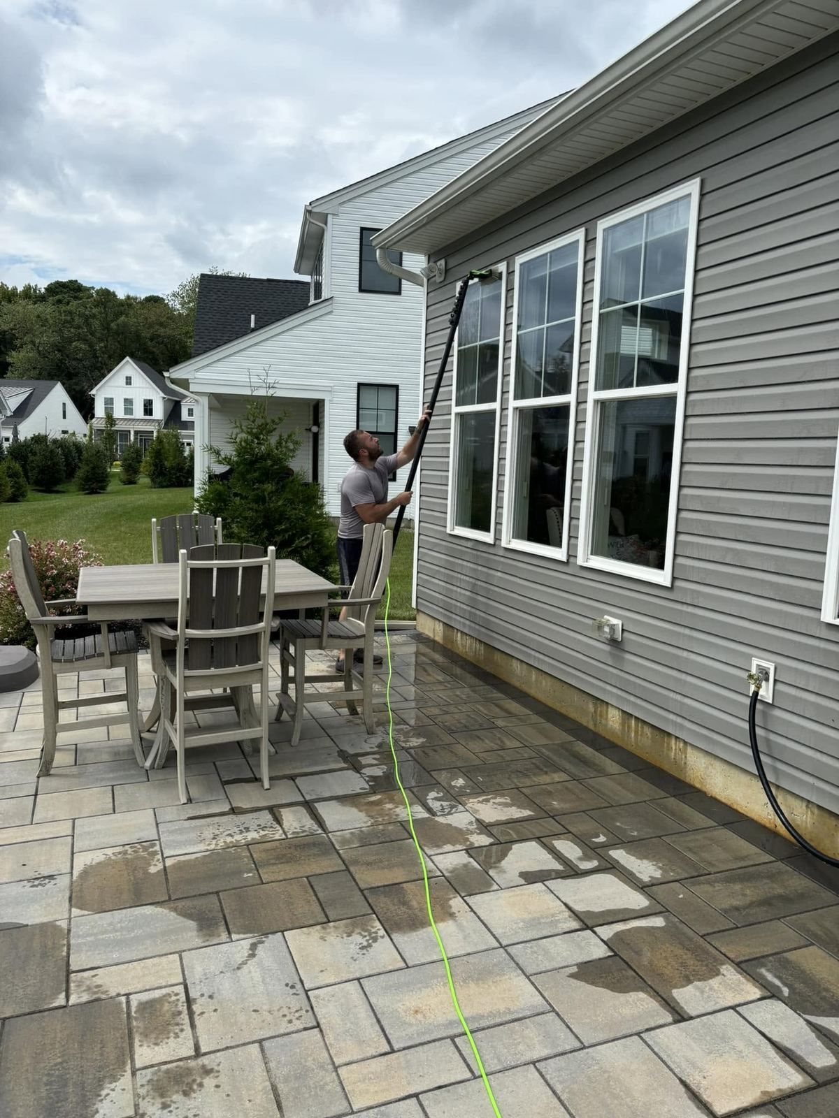 Paver patio with table, wet — Catanzaro's Power Washing