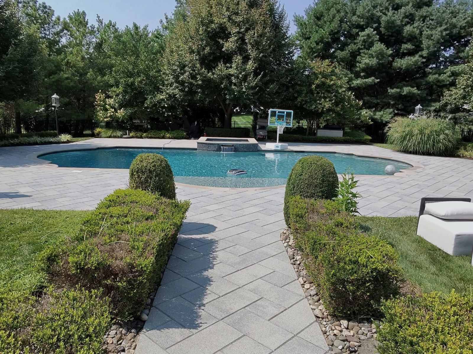 Pool paver patio with hedges, cleaned — Catanzaro's Power Washing