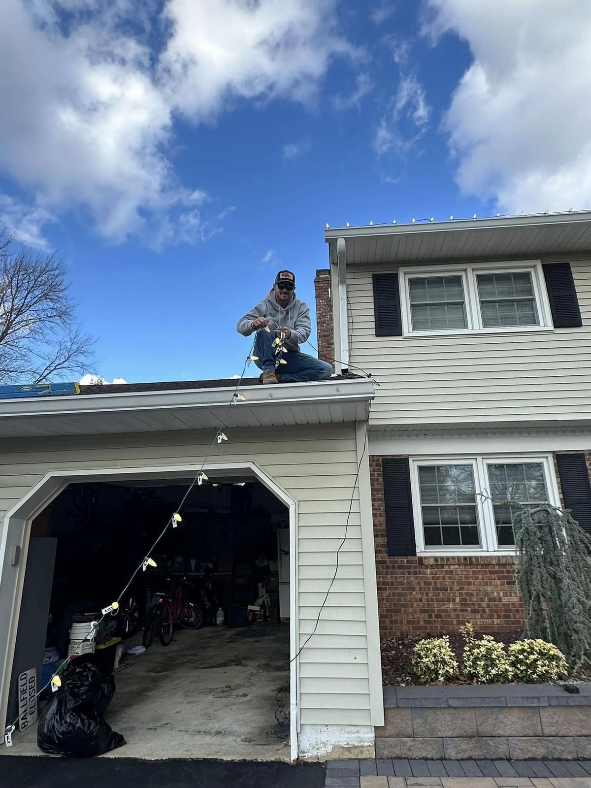Crew on roof over garage — Catanzaro's Power Washing