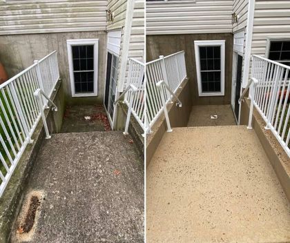 Side-by-side view of a basement stair landing before and after resurfacing, with white railings and a black door.