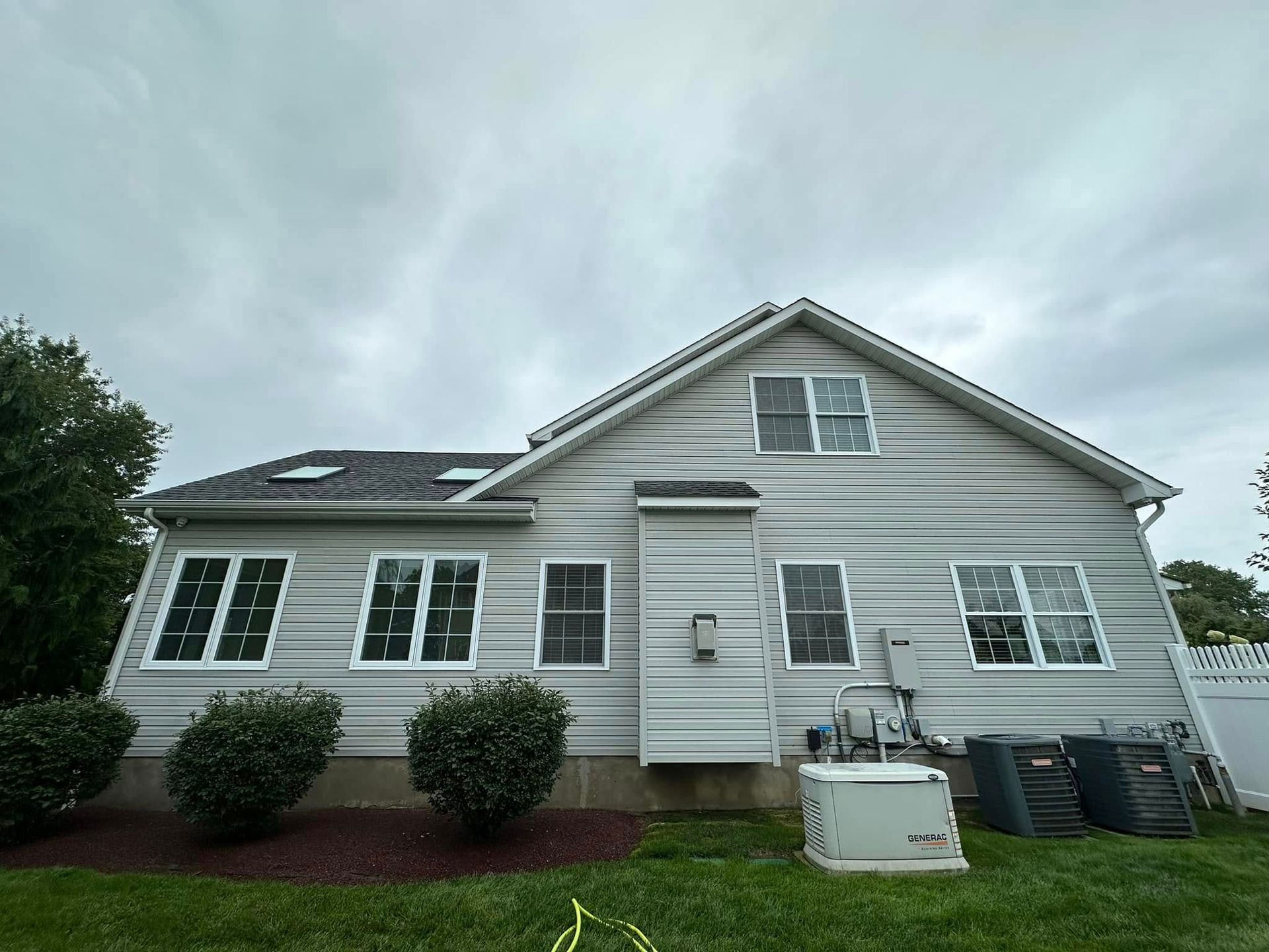 Rear of two-story, siding clean — Catanzaro's Power Washing