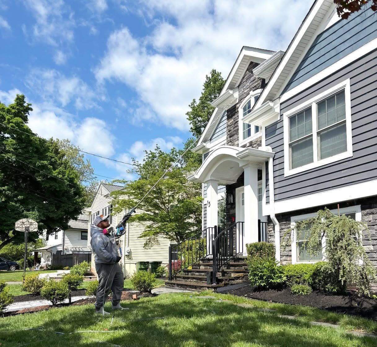 Crew washing gray-blue shingle home front — Catanzaro's Power Washing