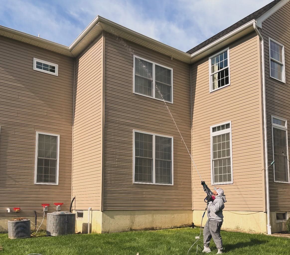 Crew washing tan siding rear — Catanzaro's Power Washing