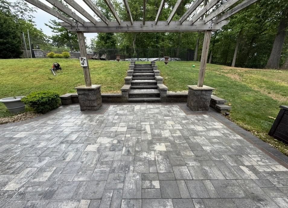 Gray paver patio under pergola, cleaned — Catanzaro's Power Washing