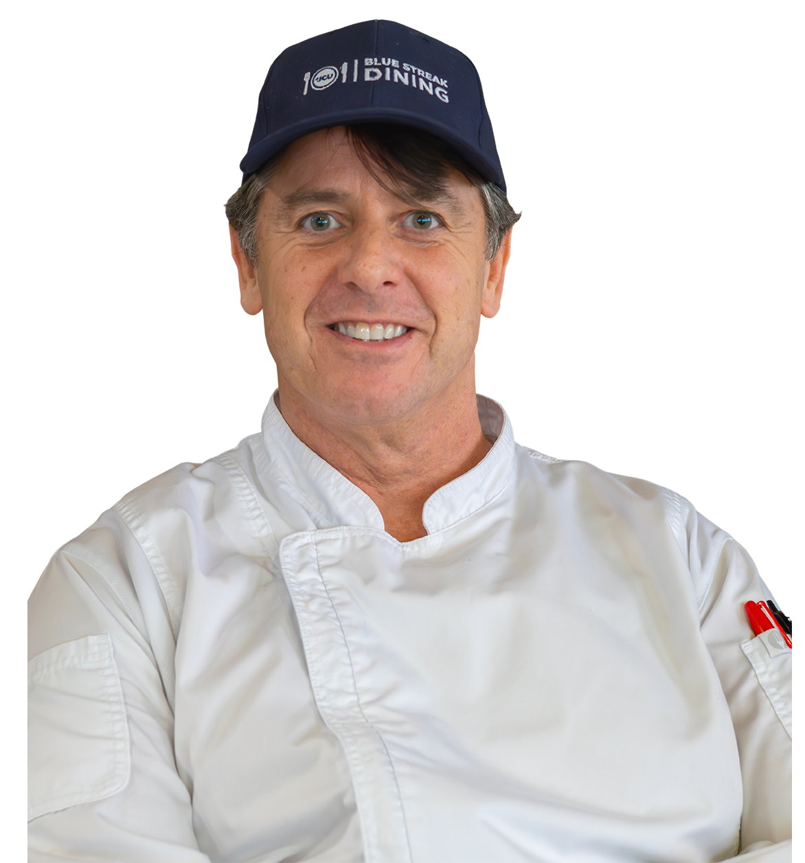 A smiling chef in a white uniform and navy blue branded cap against a plain white background.