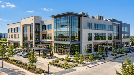 Modern commercial office building with rooftop HVAC equipment.