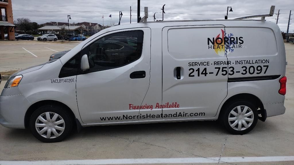 A norris van is parked in a parking lot