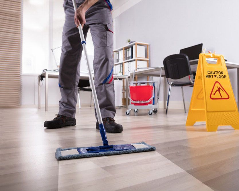 Skilled Person Mopping a Wooden Floor - Experienced Cleaner in Ballina