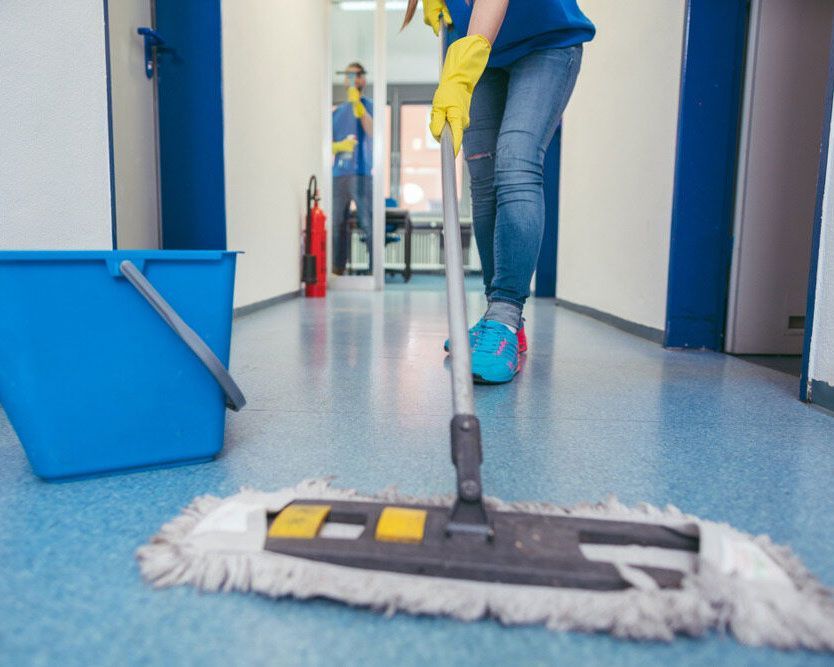 Skilled Worker Mopping an Office Building Floor - Professional Cleaner in Lennox Head