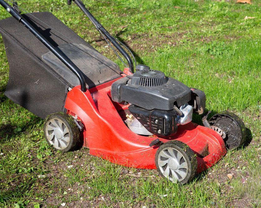 Vibrant Red Lawn Mower in Action - Expert Cleaner in Byron Bay