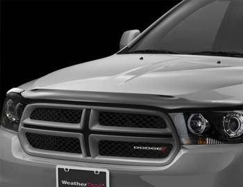 A silver dodge durango with a license plate that says weathertech