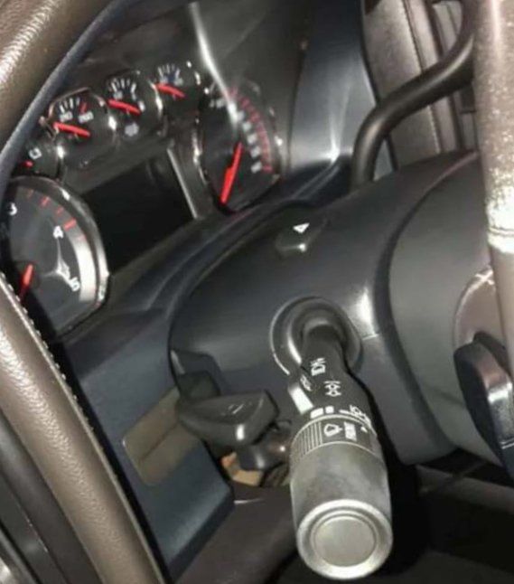 A close up of the steering wheel and dashboard of a car